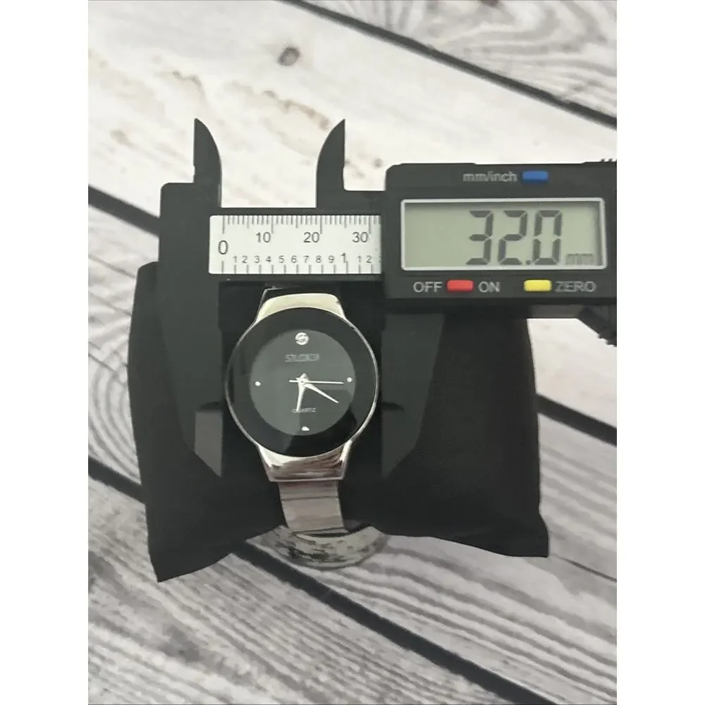 Studio Time Black Dial Silver Case And Band Women’s Cuff Watch